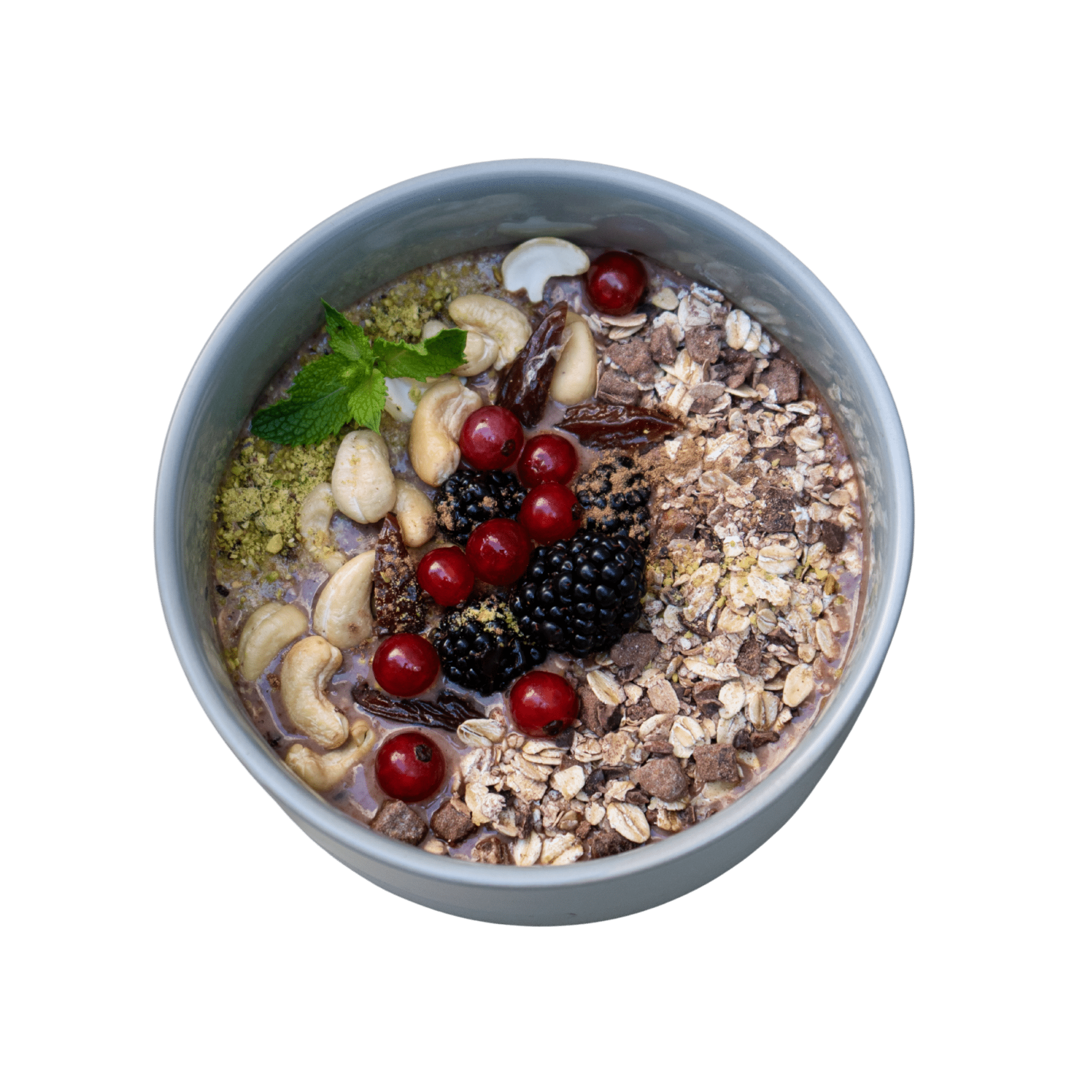 Cocoa Porridge with cashews, dates, redcurrants and blackberries
