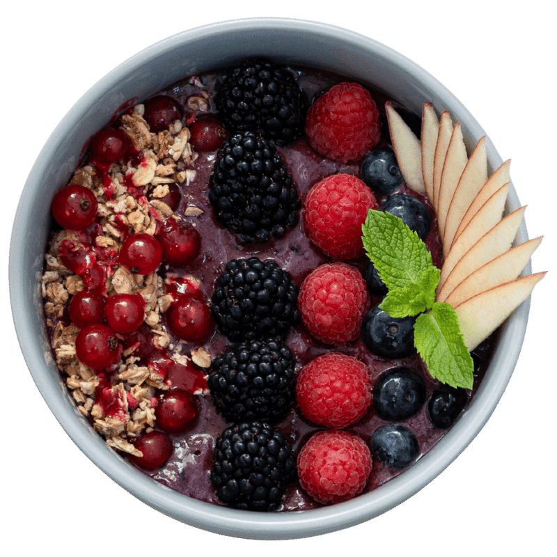 Acai Bowl topped with blackberries, raspberries, blueberries, redcurrants, apple and granola